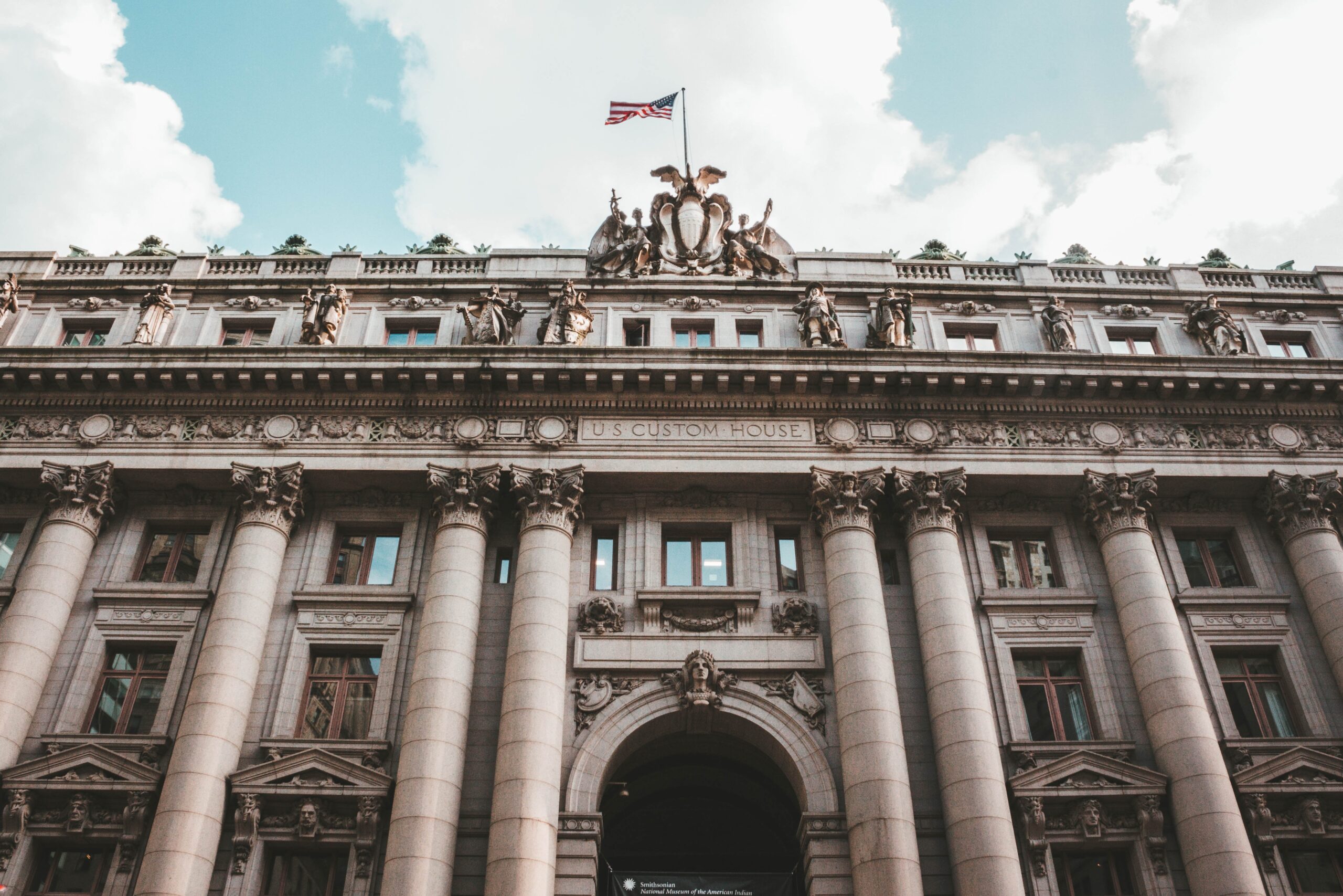 A low angle shot of the US Custom House in Battery Park, in New York, USA