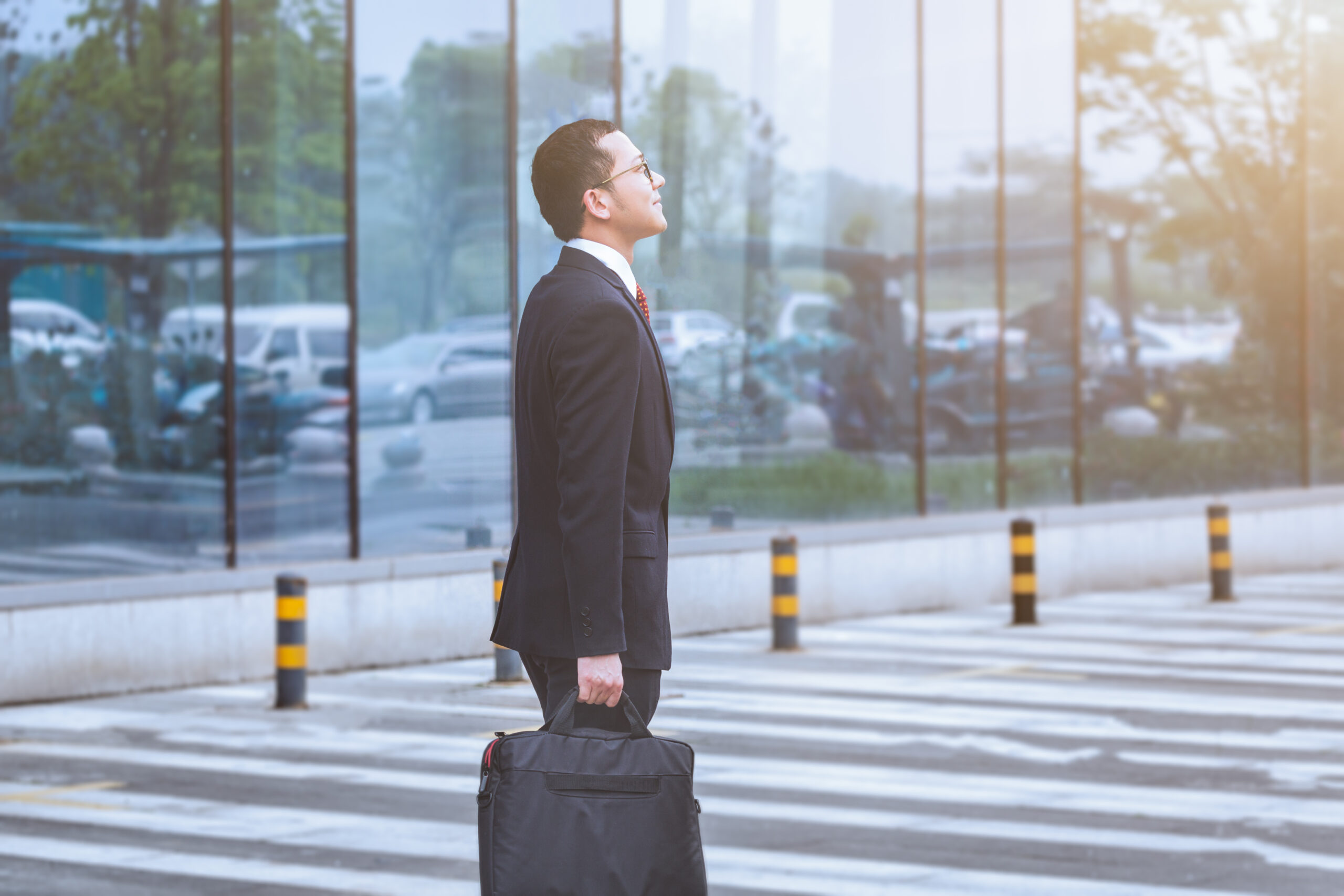 young businessman walking outside office