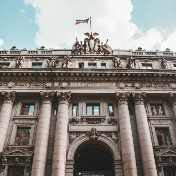 A low angle shot of the US Custom House in Battery Park, in New York, USA