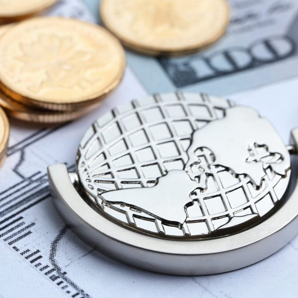 Coins, paper money and globe on white Statistic form background